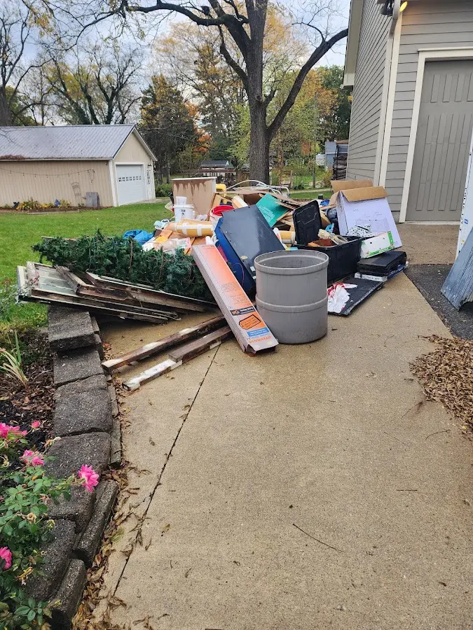 Dumpster being loaded with debris for 30 Yard Dumpster Rental in Mount Joy